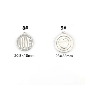 Detailed view of silver heart and circle DIY pendants in various sizes and engravings