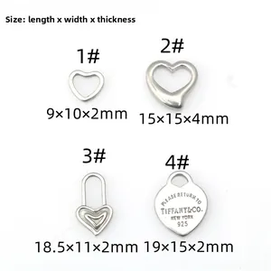 Detailed size chart showing dimensions for heart-shaped stainless steel jewelry charms