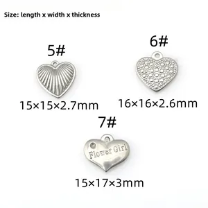 Detailed view of three textured heart-shaped stainless steel charms for DIY jewelry making