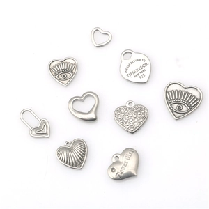 Set of 9 vintage stainless steel heart pendants with engraved patterns and slogans
