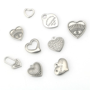 Set of heart-shaped stainless steel charms with engraved vintage silver finishes