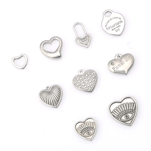 Selection of heart-shaped stainless steel charms with engraved and embossed details