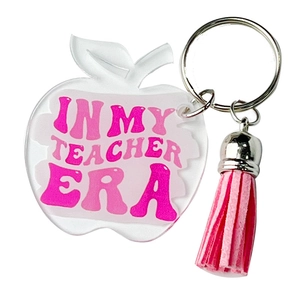 Acrylic apple keychain with pink tassel featuring 'In My Teacher Era' print for educators