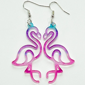 Detailed view of pink flamingo earrings with vibrant gradient resin and metal hooks