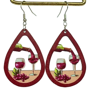 Macro detail of wine-themed wooden teardrop earrings with wine bottle and glass prints