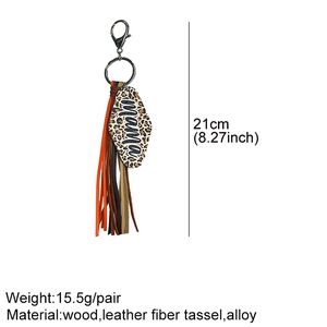Detail view of mama leopard print wooden keychain with tassels and 21cm size measurements