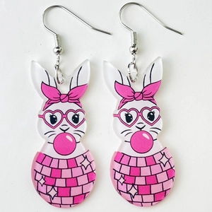 Detail of acrylic bunny earrings with pink heart glasses and disco ball patterns