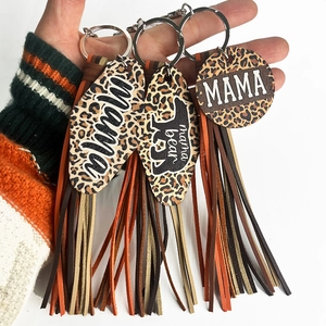 Detail of leopard print wood keychains with colorful faux leather tassels for Mom