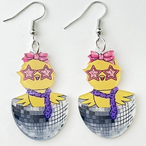 Close-up of cute acrylic chick earring with disco eggshell and yellow leopard pattern