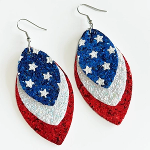 Detail of three-tier leaf earrings with US flag patterns and shiny sequin texture
