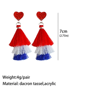Detailed view of red heart acrylic studs with layered red white and blue polyester tassels