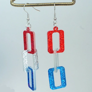 Detail view of patriotic red white and blue glittery rectangle chain link earrings