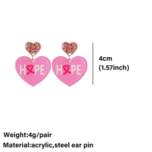 Detail view of pink acrylic heart earrings showing the 4cm size and hope ribbon design