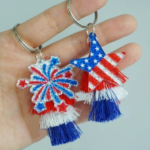 Detail view of patriotic keychains with red, white, and blue tassels and acrylic stars