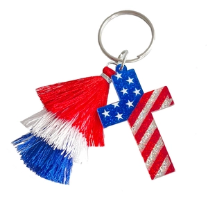 Patriotic USA flag cross keychain with red white and blue tassels on a metal ring