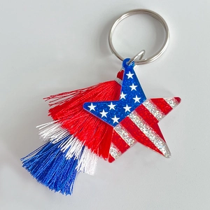 Patriotic USA flag star keychain with red white blue layered tassels on metal ring
