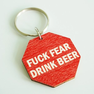 Funny octagonal red keychain with Fuck Fear Drink Beer text for beer lovers