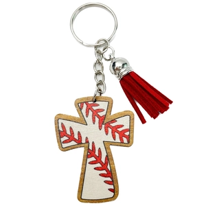 Detail of wooden cross keychain with baseball stitch pattern and red suede tassel