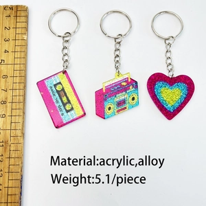 Detailed view of retro acrylic keychains with ruler showing 4cm size and glitter finish