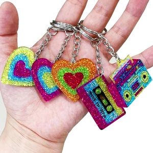 Five retro keychain set with glitter heart, cassette, and radio charms in 90s style