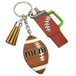 Rugby mom keychain with brown tassel and tumbler charm on white background