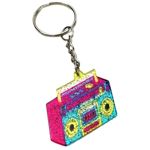 Detail of retro radio keychain featuring colorful glitter sequins and vibrant gradients