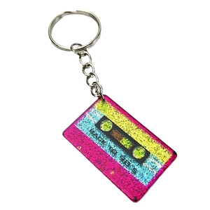 Retro 90s cassette keychain with colorful glitter and Back To 90s text on white background