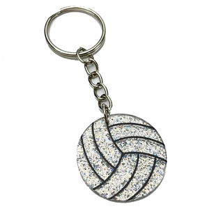 Vue détaillée d'un porte-clés de volley-ball à paillettes argentées avec chaîne en métal