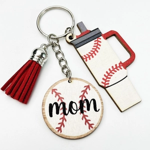 Macro detail of wooden baseball mom keychain with red tassel and cup charm charm