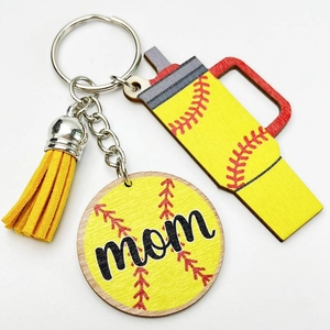 Detail of softball mom keychain with wooden charms, cup shape and yellow leather tassel