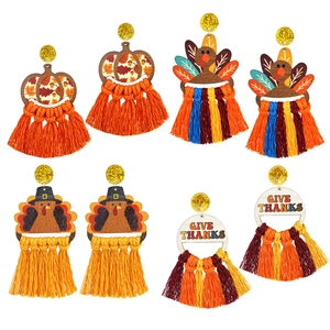 Detailed set of Thanksgiving earrings featuring turkeys and pumpkins with colorful tassels
