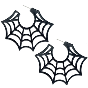Close-up of spider web hoop earrings with black glitter finish for Halloween