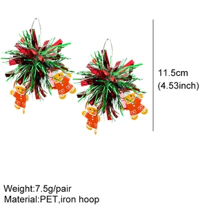 Macro detail of Christmas gingerbread man earrings with red green PET pom-poms