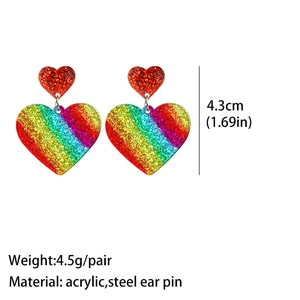 Detail view of heart-shaped rainbow glitter acrylic earrings with 4.3cm size scale