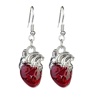 Detailed view of red anatomical heart earrings with silver hooks for Gothic jewelry