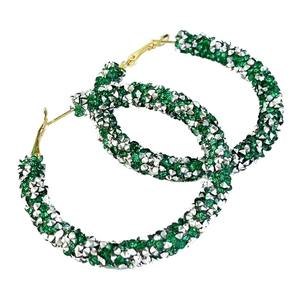 Detail of green and silver glitter crystals on large gold-tone hoop earrings