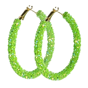 Neon green glitter hoop earrings with golden hooks for St. Patrick's Day fashion