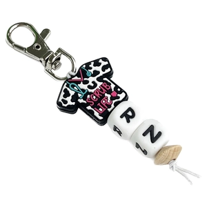 Nurse keychain featuring Scrub Life silicone charm with RN alphabet beads on white background