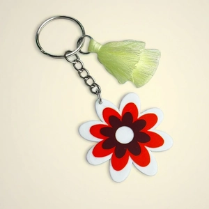 Retro floral keychain featuring a colorful flower charm and light green silk tassel fringe