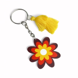 Vintage floral tassel keychain with layered colorful petals and yellow fringe ornament
