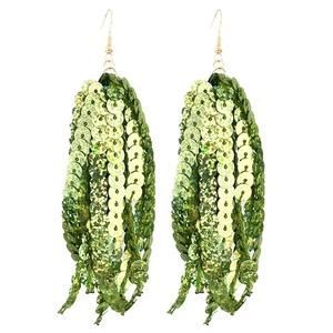 Detail of green sequin tassel earrings with golden hooks for St. Patrick's Day party