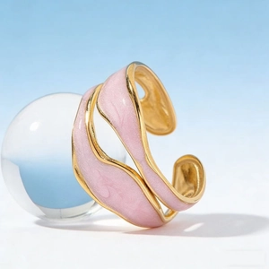 Modern gold-plated stainless steel open ring with pink enamel wave pattern design
