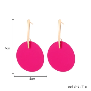 Detail view of large magenta round drop earrings with dimensions 7cm length and 4cm width