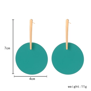 Modern geometric long drop earrings with gold metal bar and large teal round matte pendant
