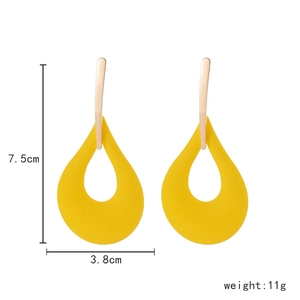 Detailed view of yellow teardrop hollow earrings with 7.5cm height and 3.8cm width specs