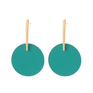 Detail of teal matte disc earrings with rose gold geometric metal bars on white background