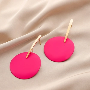 Detailed view of matte rose red round earrings with gold bars on beige silk fabric