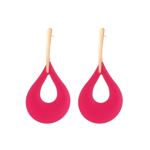 Detail of matte fuchsia teardrop earrings with golden hardware and cutout design