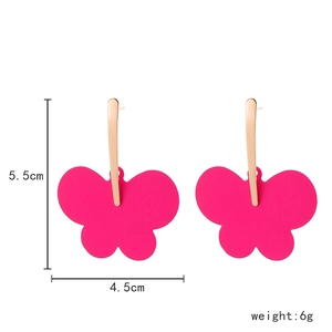 Detail view showing dimensions of pink butterfly drop earrings with gold metal hooks
