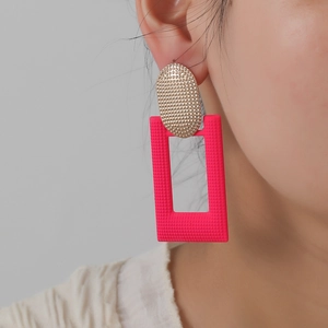 Retro geometric earrings with gold oval metal and textured bright pink hollow rectangle